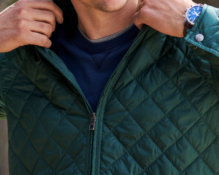 Male wearing green outerwear jacket.
